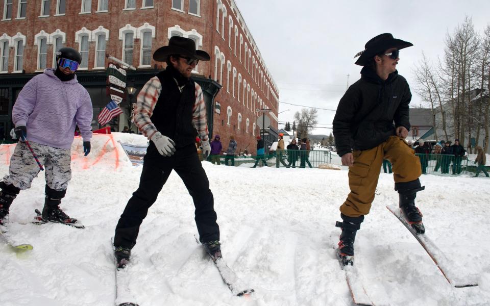 Skiers at the competition test out the snow prior to the start of the 76th annual races