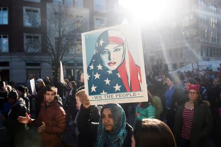 The Boston Women's March for America makes its way down Boylston Street in Boston, Massachusetts, U.S., January 21, 2017. REUTERS/Sam Goresh