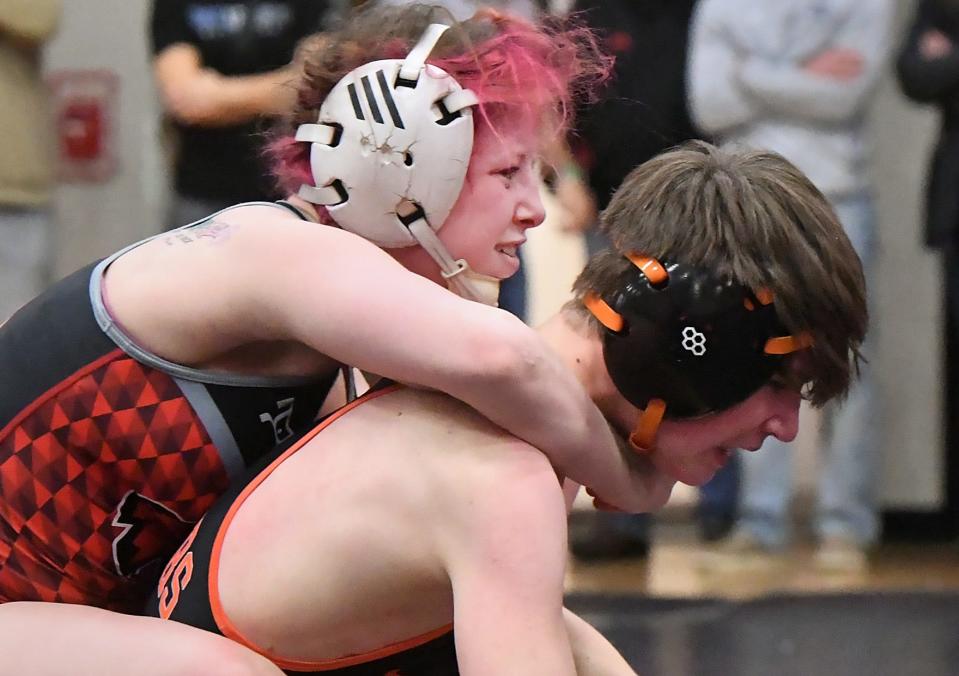 At 107 pounds, Northwestern High School's Sierra Chiesa, left, defeated Corry's Wyatt Swan 6-2 to win the District 10 Class 2A Section 1 title at Meadville Area Senior High School in Meadville on Saturday.