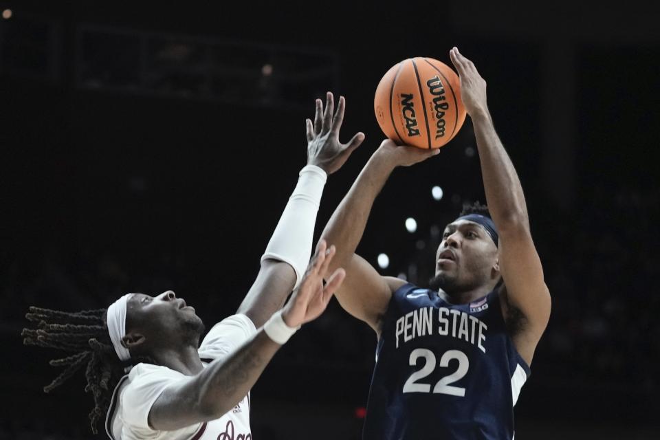 Penn State's Jalen Pickett shoots over Texas A&M's Manny Obaseki during the first half of a first-round college basketball game in the NCAA Tournament Thursday, March 16, 2023, in Des Moines, Iowa. (AP Photo/Morry Gash)