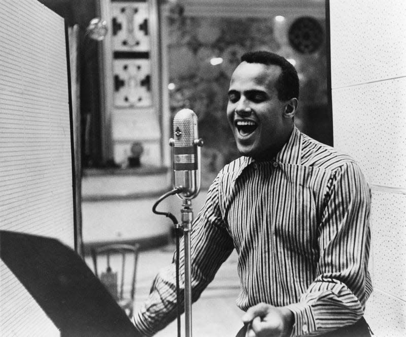 Harry Belafonte performing in a recording studio, circa 1957.