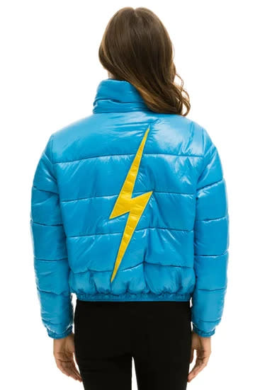 Light blue puffer jacket with yellow lightning bolt