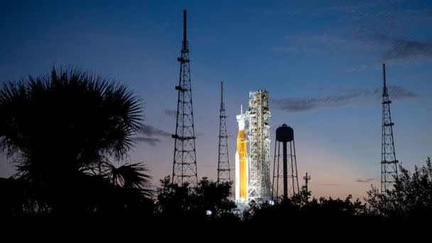 PHOTO: NASA's Space Launch System (SLS) rocket with the Orion spacecraft aboard is illuminated by spotlights after sunset atop the mobile launcher at Launch Pad 39B as preparations for launch continue, Nov. 6, 2022. (NASA via Getty Images)