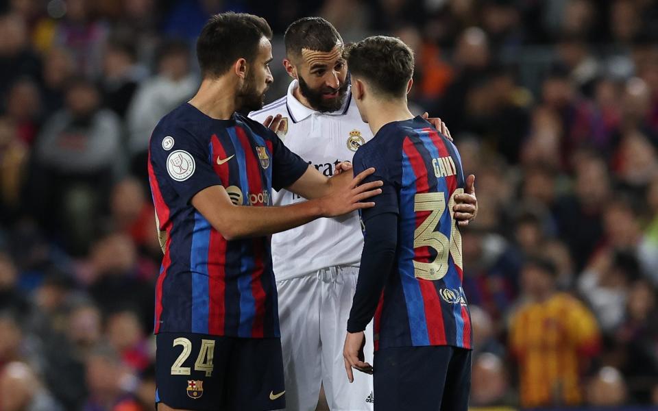 Real Madrid's forward Benzema argues with Barcelona's Spanish midfielder Gavi during the Kings Cup semi-final second-leg match at the Camp Nou stadium on April 5 - Adria Puig/Getty Images