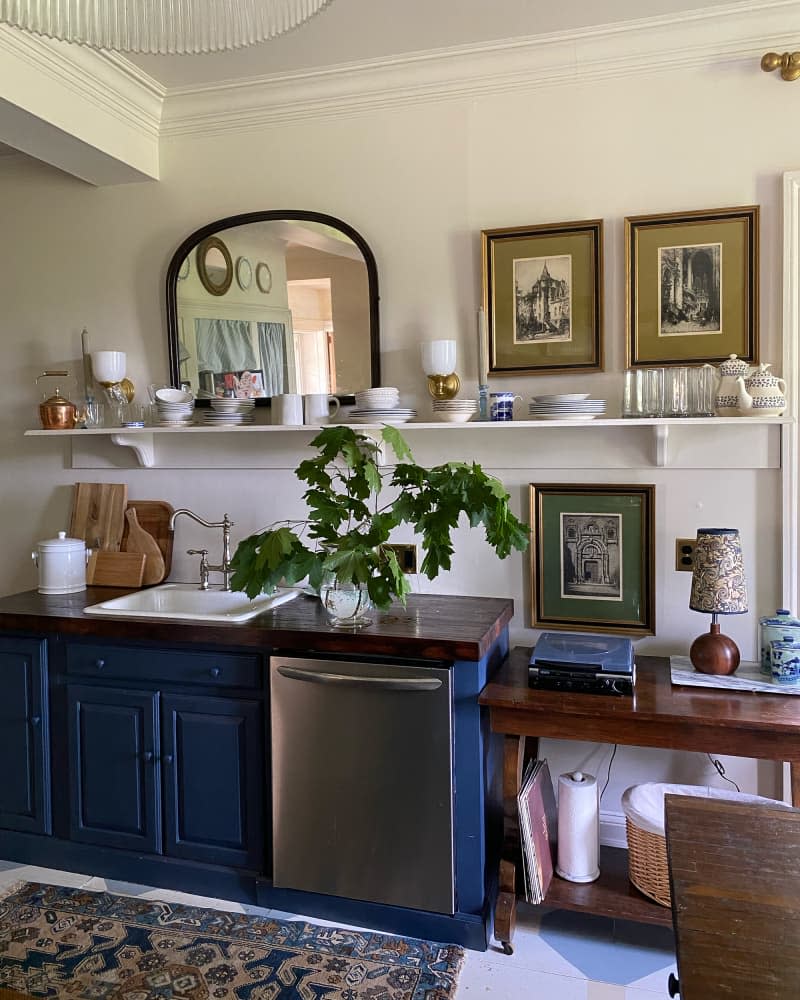 Kitchenwares on display on kitchen shelf after renovation.