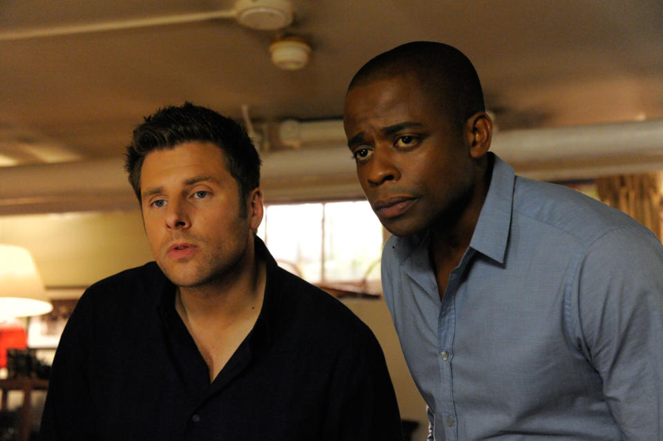 Two actors portraying Shawn and Gus from the TV show "Psych" look off-screen with concerned expressions