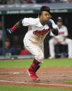 Cleveland Indians' Jose Ramirez runs out an infield hit off Chicago White Sox relief pitcher Ryan Burr during the sixth inning of a baseball game in Cleveland, Friday, Sept. 24, 2021. (AP Photo/Phil Long)