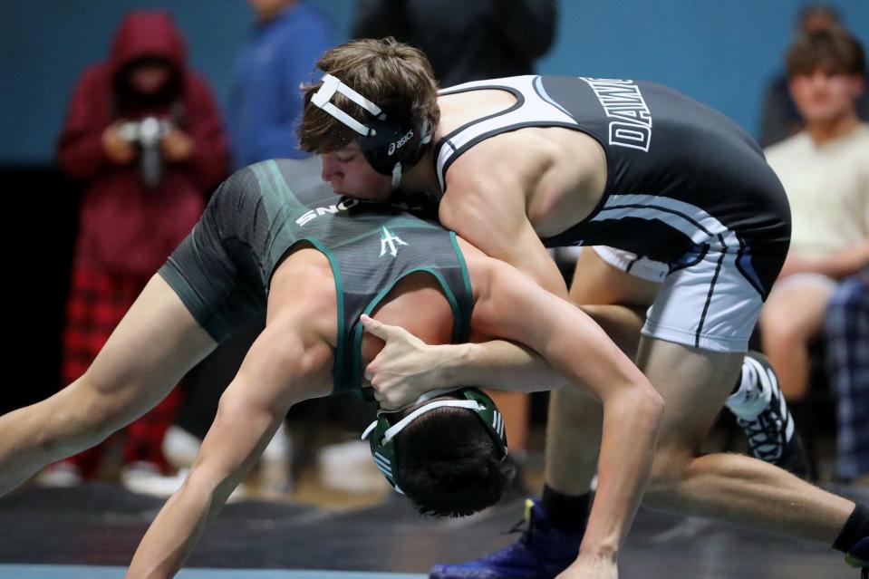 Buena's Matthew Homan tries to take down his opponent in a 182-pound match during the Channel League wrestling finals at Rio Mesa High on Saturday. Homan finished second to qualify for the CIF-SS Individuals.