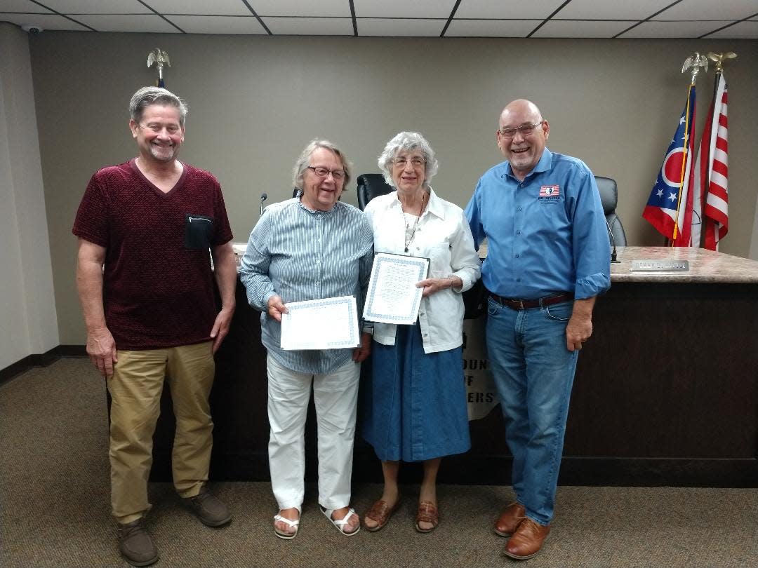 Pictured are Commissioner Mike Welch, Annis Strine, Ada Sue Workman and Commissioner James Justice.