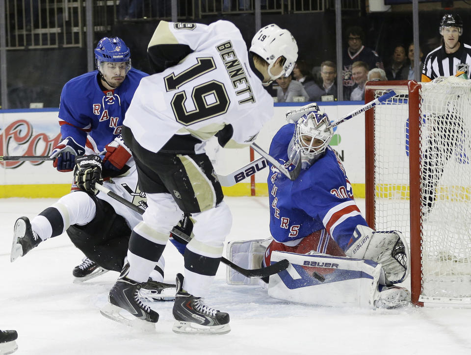 New York Rangers goalie Henrik Lundqvist (30), of Sweden, stops a shot on the goal by Pittsburgh Penguins' Beau Bennett (19) during the first period of a second-round NHL Stanley Cup hockey playoff series Wednesday, May 7, 2014, in New York. (AP Photo/Frank Franklin II)