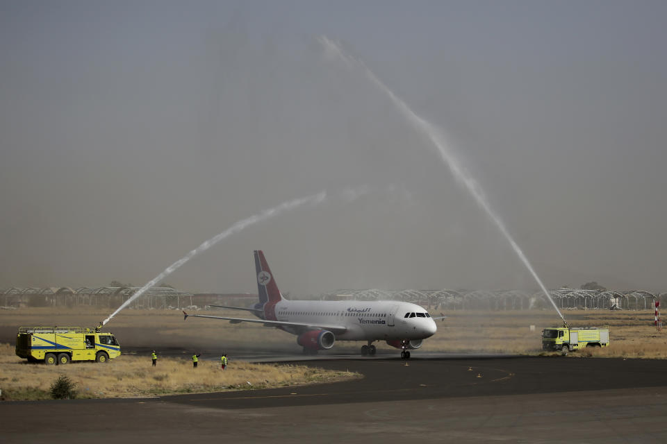 A Yemen Airways plane is greeted with a water spray salute at the Sanaa international airport in Sanaa, Yemen, Monday, May, 16, 2022. The first commercial flight in six years took off from Yemen’s rebel-held capital on Monday, officials said, part of a fragile truce in the county’s grinding civil war. (AP Photo/Hani Mohammed)