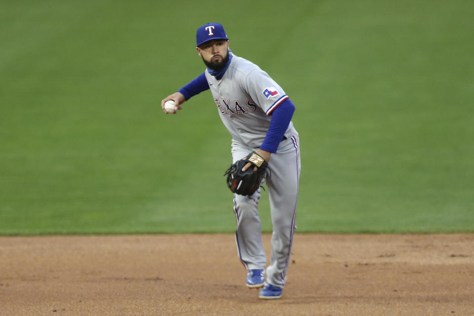 Texas Rangers' Isiah Kiner-Falefa throws to first after fielding a ball hit by Minnesota Twins' Kyle Garlick, who was out during the second inning of a baseball game Wednesday, May 5, 2021, in Minneapolis. (AP Photo/Stacy Bengs)