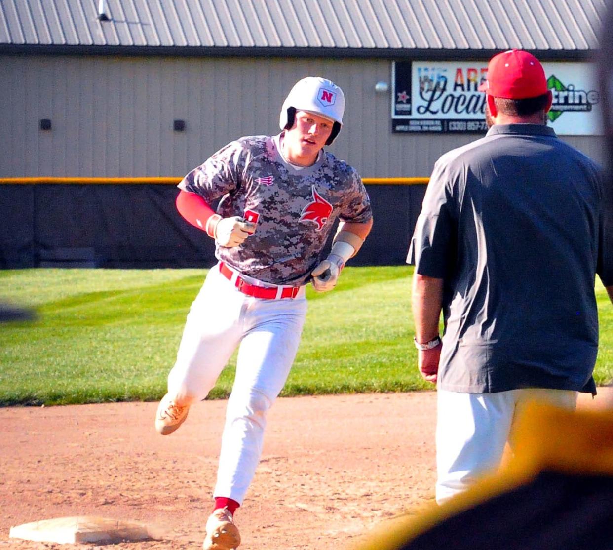 Norwayne batter Logan Dichler rounds third after his home run to right field against Waynedale.