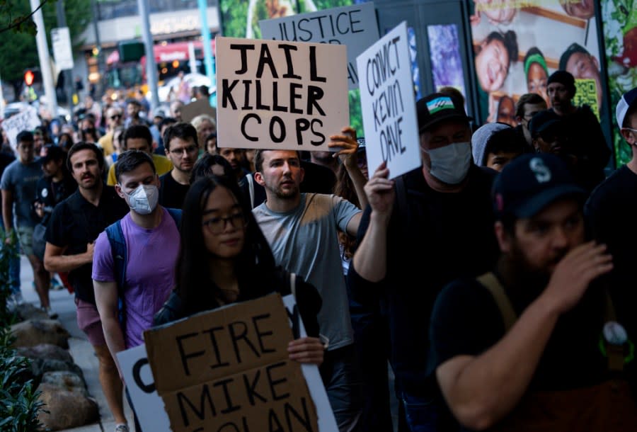Protesters march through downtown Seattle after body camera footage was released of a Seattle police officer joking about the death of Jaahnavi Kandula, a 23-year-old woman hit and killed in January by officer Kevin Dave in a police cruiser, Thursday, Sept. 14, 2023, in Seattle. (AP Photo/Lindsey Wasson)
