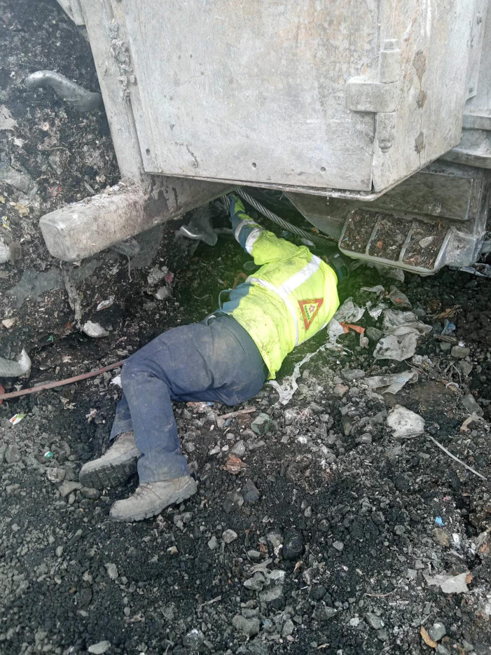 Coffin Butte Landfill mechanics say they must lie down in waste to repair equipment.