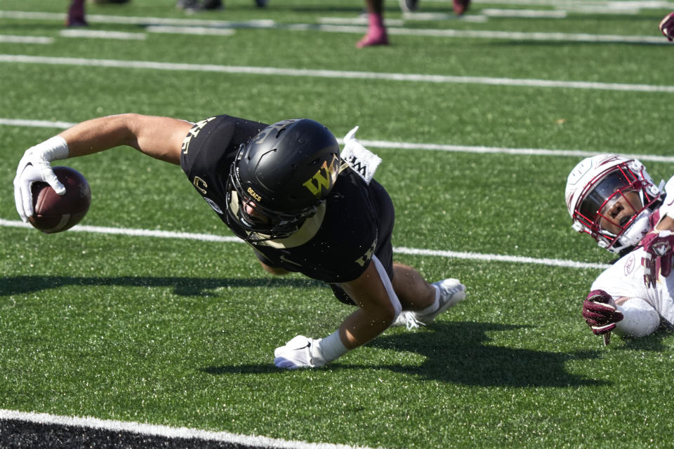 Wake Forest wide receiver Taylor Morin, left, reaches in vain for the end zone as Florida State defensive back Shyheim Brown, right, defends during the first half of an NCAA college football game in Winston-Salem, N.C., Saturday, Oct. 28, 2023. (AP Photo/Chuck Burton)