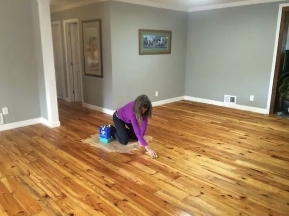 woman in the middle of a freshly painted floor