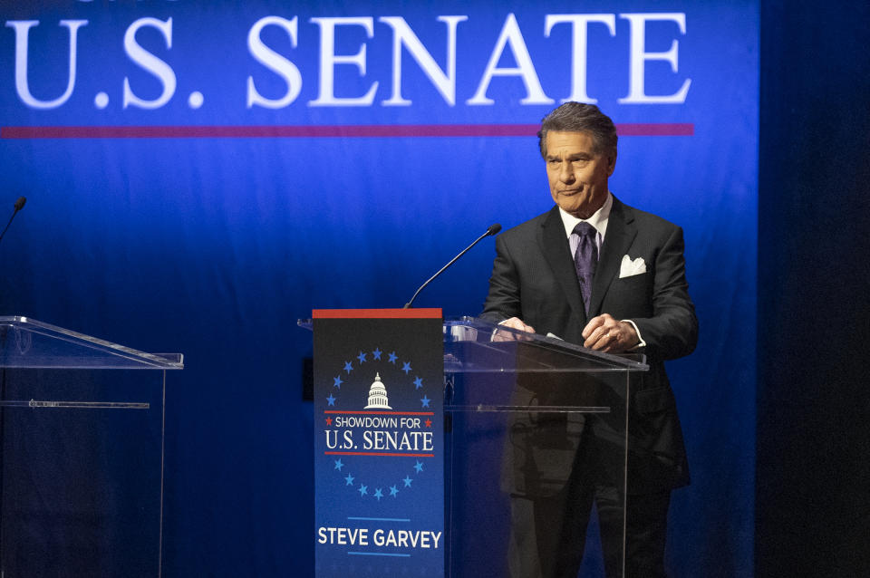 Former baseball player Steve Garvey stands up at a televised debate for candidates in the senate race to succeed the late California Sen. Dianne Feinstein on Jan. 22, 2024, in Los Angeles. The candidacy for the U.S. Senate of former California baseball star Garvey has brought a splash of celebrity to the race that has alarmed his Democratic rivals and tugged at the state's political gravity. (AP Photo/Damian Dovarganes)