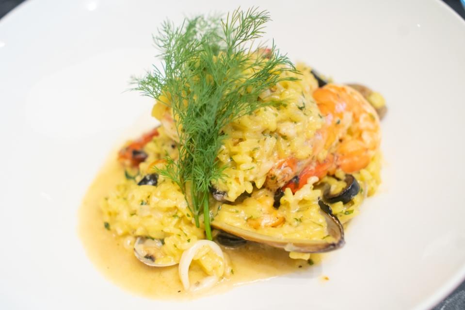 Seafood Saffron Risotto is packed with seafood that pairs well with the fragrant golden hue risotto