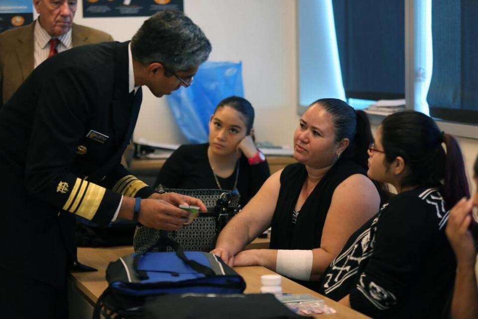 Left to right, U.S. Surgeon General Vivek H. Murthy speaks with Blanca Irahera, center, at Borinquen Medical Center on Friday, August 12, 2016.