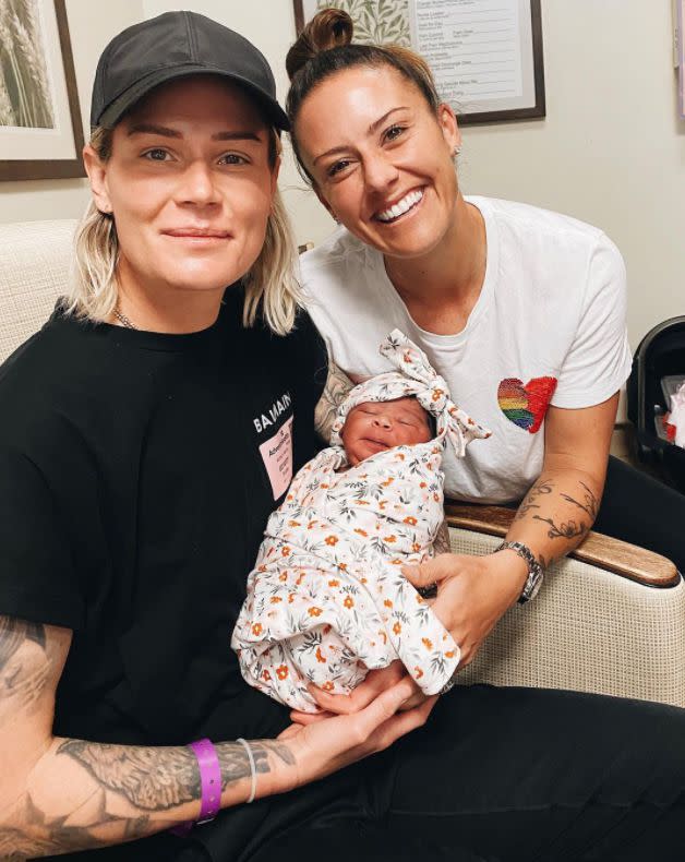 U.S Women's Soccer Team players Ashlyn Harris and Ali Krieger are all smiles as they welcome their newly-adopted baby into their family. The new moms, married in Dec. 2019, welcomed daughter Sloane Philips on Feb. 12, 2021. "we are so in love with you already! This has been one of the most beautiful yet stressful processes I’ve ever experienced with you, @ashlynharris24 and I love you even more throughout this journey, if that’s even possible."