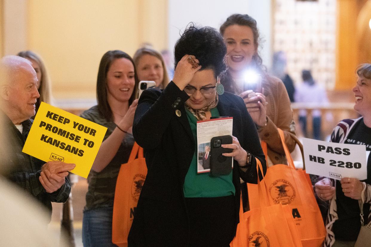 A new report from the Institute for Research and Education on Human Rights found a growing number of legislators in "far-right" Facebook groups, including Rep. Tatum Lee, R-Ness City, pictured here at an anti-vaccine rally in the Statehouse last month.