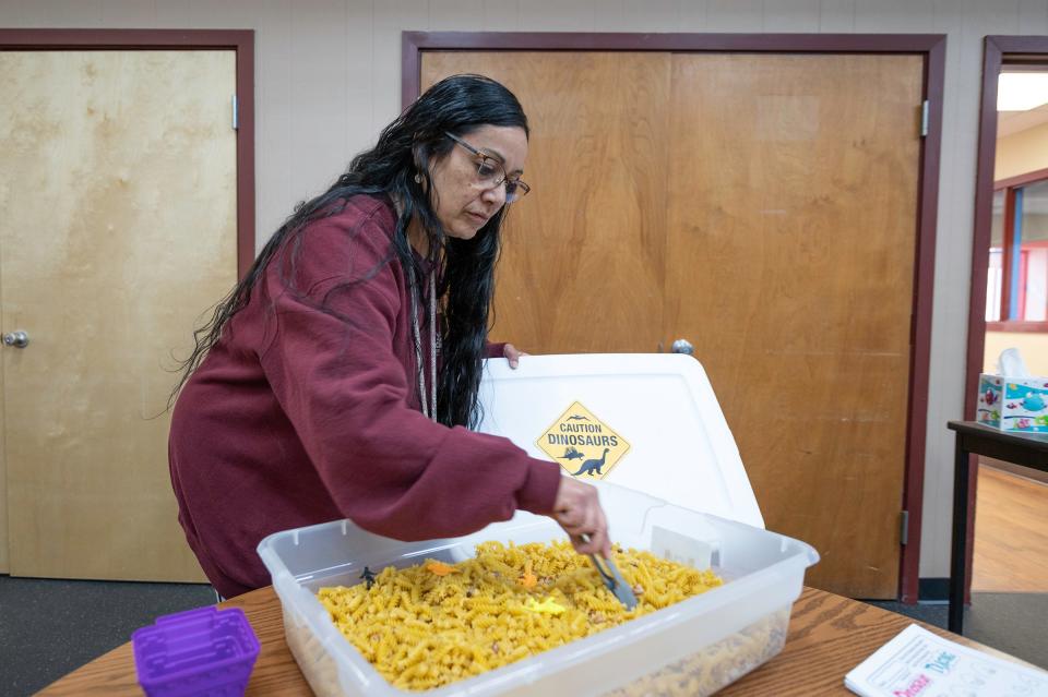 Recreation Specialist Paula DeHerrera shows a sensory tub that is used during "Inclusion Hour" at El Centro Del Quinto Sol recreation center on Friday.