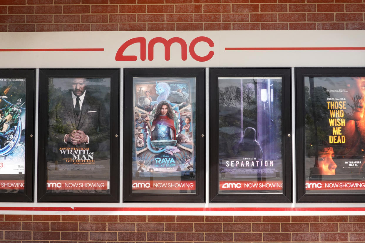 CHICAGO, ILLINOIS - JUNE 01: Movie poster of current offerings are displayed on the front of an AMC theater on June 01, 2021 in Chicago, Illinois. Mudrick Capital has agreed to purchase 8.5 million share of the theater chain for $230.5 million. (Photo by Scott Olson/Getty Images)