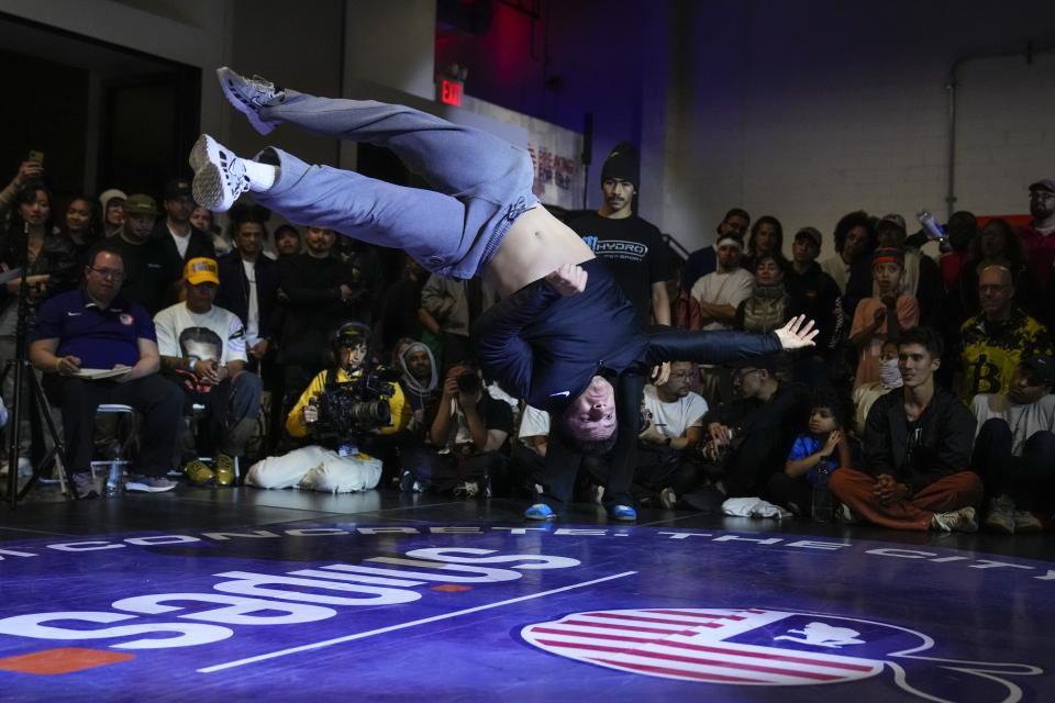 Mace Maya, also known as B-Boy Mace, competes against Nelzwon during the semifinals in the Breaking for Gold Big Apple breakdancing regional competition Saturday, April 22, 2023, in the Brooklyn borough of New York. The hip-hop dance form makes its official debut at the Paris Games in 2024. (AP Photo/Frank Franklin II)