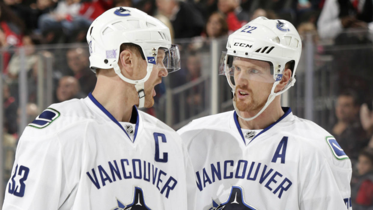 With a combined 2,106 points, Daniel and Henrik Sedin are among the highest-scoring brothers in NHL history. (Getty)