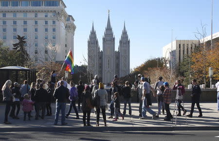 Members of The Church of Jesus Christ of Latter-day Saints and their supporters walk near the Salt Lake Temple after mailing their membership resignation to the church in Salt Lake City, Utah November 14, 2015. REUTERS/Jim Urquhart