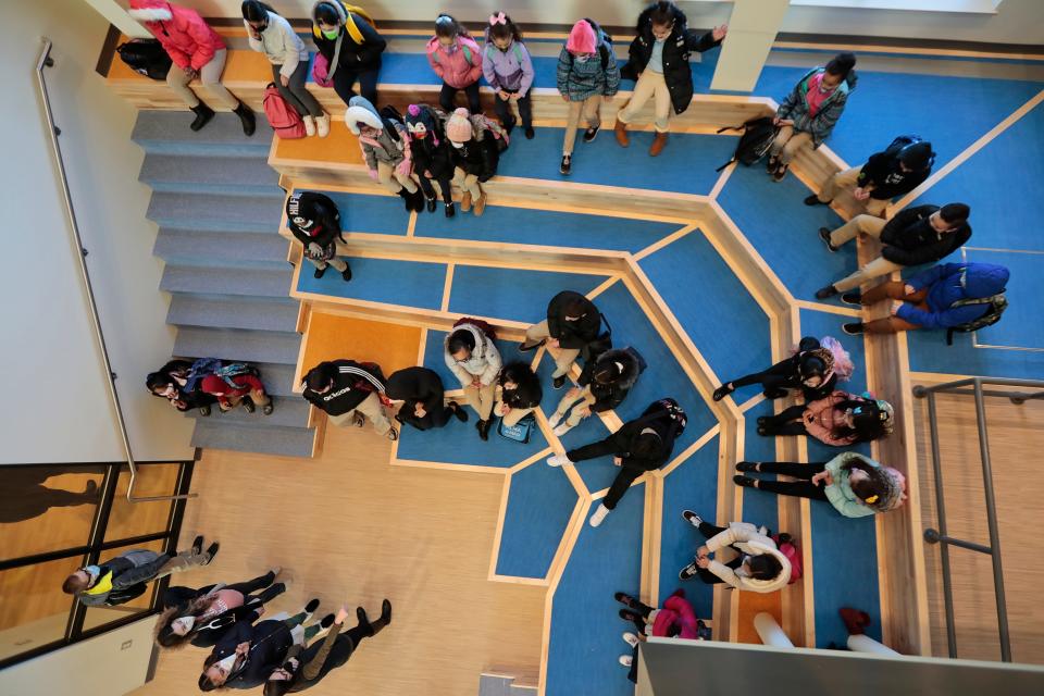 Students listen to teachers at one of the new spaces found at the new Alma del Mar Frederick Douglass campus on Church Street in New Bedford.