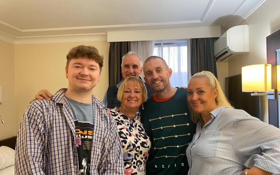 Shaun Pinner (centre right) reunited with his family in the UK - Foreign, Commonwealth & Development Office/PA