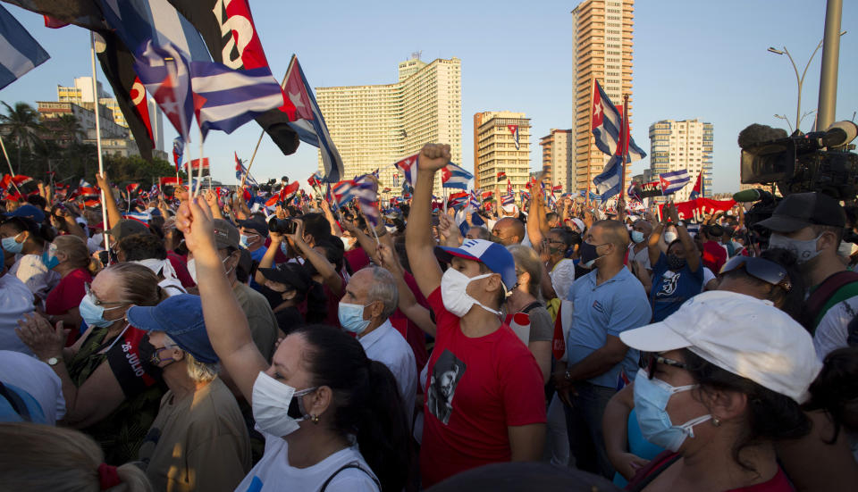 People attend a cultural-political event on the seaside Malecon Avenue with thousands of people in a show of support for the Cuban revolution six days after the uprising of anti-government protesters across the island, in Havana, Cuba, Saturday, July 17, 2021. (AP Photo / Ismael Francisco)