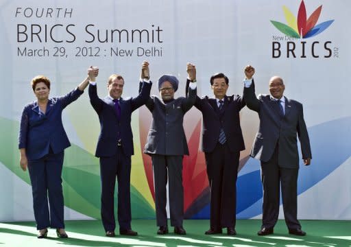 Heads of the BRICS countries pose prior to the BRICS summit in New Delhi, March 2012. China and other BRICS emerging economies are set to flex their muscles as the top finance officials of the G20 and the IMF meet seeking to raise $400 billion to prevent financial contagion