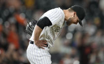 Colorado Rockies relief pitcher Daniel Bard reacts after giving up a solo home run to San Francisco Giants' Mike Yastrzemski in the ninth inning of a baseball game Monday, May 16, 2022, in Denver. (AP Photo/David Zalubowski)