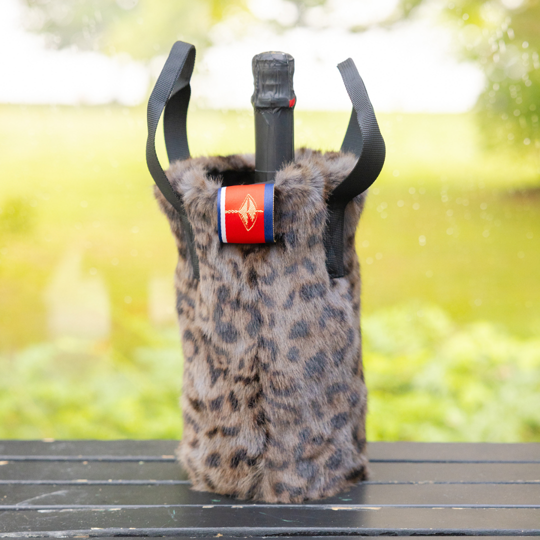 <p><a href="https://go.redirectingat.com?id=74968X1596630&url=https%3A%2F%2Fprettyruggedshop.com%2Fproducts%2Fluxe-faux-fur-grey-leopard-wine-tote&sref=https%3A%2F%2Fwww.thepioneerwoman.com%2Fhome-lifestyle%2Fentertaining%2Fg32293314%2Fhostess-gifts-ideas%2F" rel="nofollow noopener" target="_blank" data-ylk="slk:Shop Now;elm:context_link;itc:0;sec:content-canvas" class="link rapid-noclick-resp">Shop Now</a></p><p>The Rowling Grey Leopard Faux Fur Wine Tote</p><p>prettyruggedshop.com</p><p>$30.00</p><span class="copyright">Pretty Rugged</span>