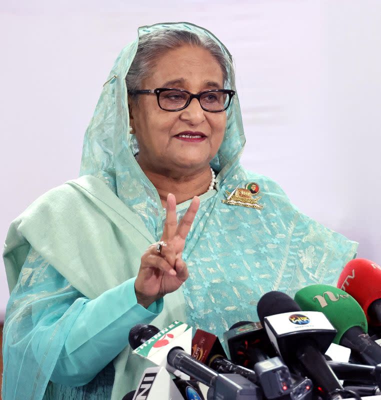 Sheikh Hasina, Prime Minister of Bangladesh and Chairperson of Bangladesh Awami League, shows victory sign while speaking to the press in Dhaka