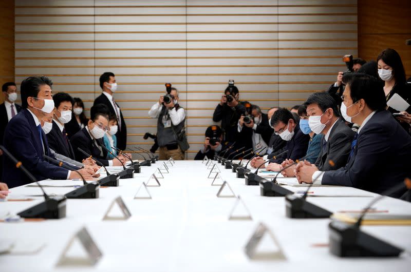 Japan's Prime Minister Shinzo Abe speaks during a meeting about the measures against the coronavirus disease (COVID-19), at the prime minister official residence in Tokyo