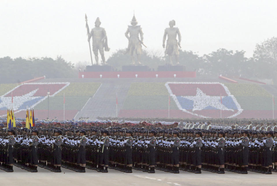 FILE - In this March 27, 2019, file photo, Myanmar military officers stand in a formation during a parade to mark the 74th Armed Forces Day in Naypyitaw, Myanmar. A United Nations fact-finding mission is calling for an embargo on arms sales to Myanmar and targeted sanctions against businesses with connections to the military that it says are helping fund human rights abuses, report released Monday, Aug. 5, 2019. (AP Photo/Aung Shine Oo, File)