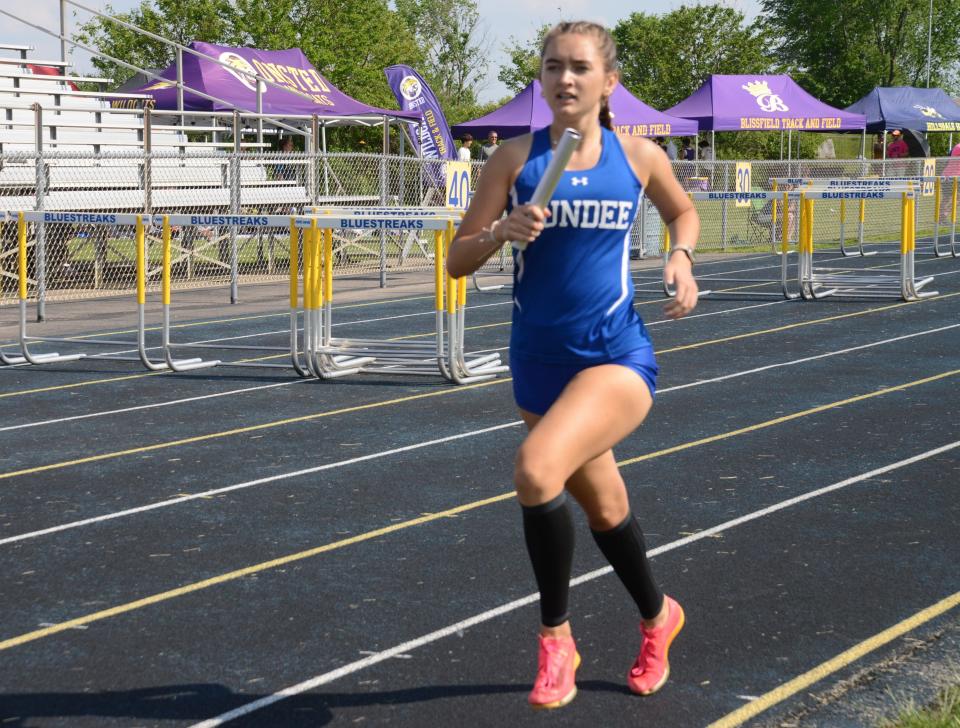 Natalie Swisher of Dundee finishes the 3,200 relay at the Lenawee County Athletic Association track and field championships at Ida on Tuesday, May 21, 2024.