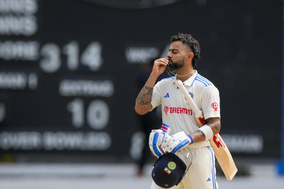 India's Virat Kohli celebrates after he scored a century against West Indies on day two of their second cricket Test match at Queen's Park in Port of Spain, Trinidad and Tobago, Friday, July 21, 2023. (AP Photo/Ricardo Mazalan)