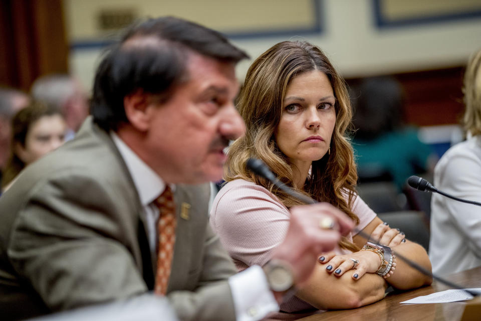 Ruby Johnson, right, who's daughter was recently hospitalized with a respiratory illness from vaping, listens as American Lung Association Chief Medical Officer Dr. Albert Rizzo, left, testifies before a House Oversight subcommittee hearing on lung disease and e-cigarettes on Capitol Hill in Washington, Tuesday, Sept. 24, 2019. (AP Photo/Andrew Harnik)