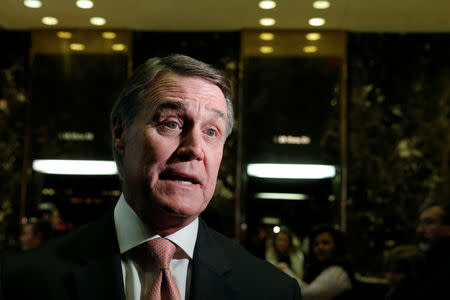 FILE PHOTO: U.S. Senator David Perdue (R-GA) speaks to members of the media after meeting with U.S. President-elect Donald Trump at Trump Tower in New York, U.S., December 2, 2016. REUTERS/Mike Segar