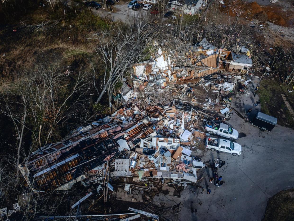 PHOTO: In an aerial view, a mobile home park where three people perished is seen in the aftermath of a tornado, Dec. 10, 2023, in Madison, Tenn. (Jon Cherry/Getty Images)