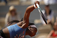 Coco Gauff of the U.S. serves against Poland's Iga Swiatek during their quarterfinal match of the French Open tennis tournament at the Roland Garros stadium in Paris, Wednesday, June 7, 2023. (AP Photo/Christophe Ena)