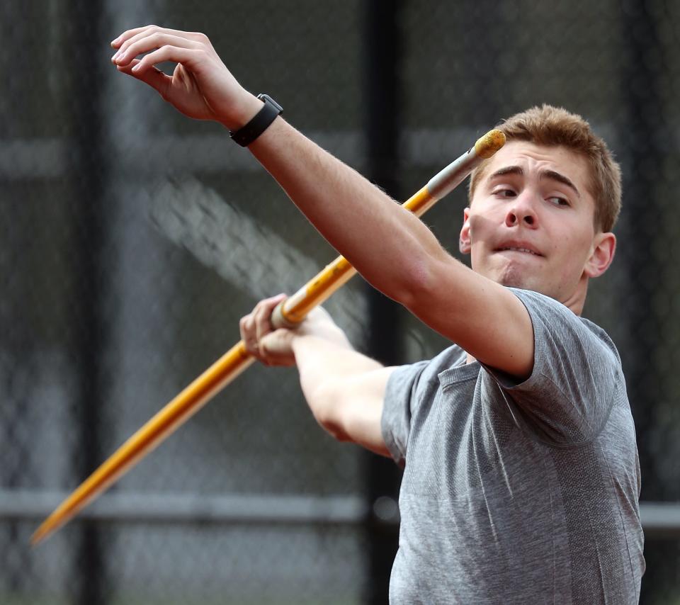 Central Kitsap javelin thrower Roderick Schenk practices with teammates and coach Bill Braun on Wednesday, April 5, 2023.