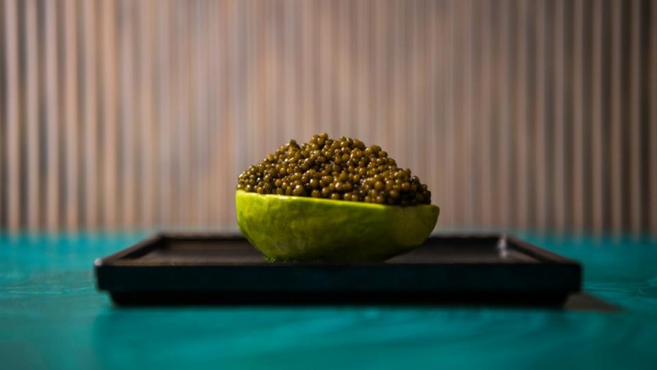 A signature dish of caviar and avocado - Credit: Major Food Group