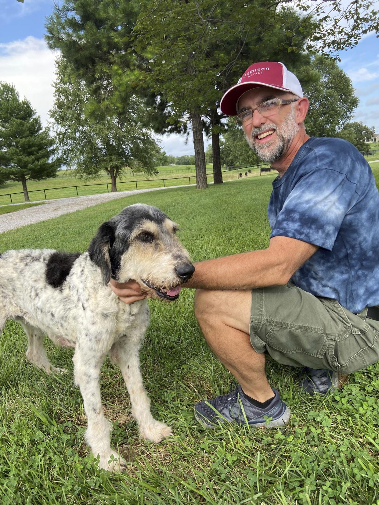 Jeff Bohnert and his dog Abby after being reunited this month.