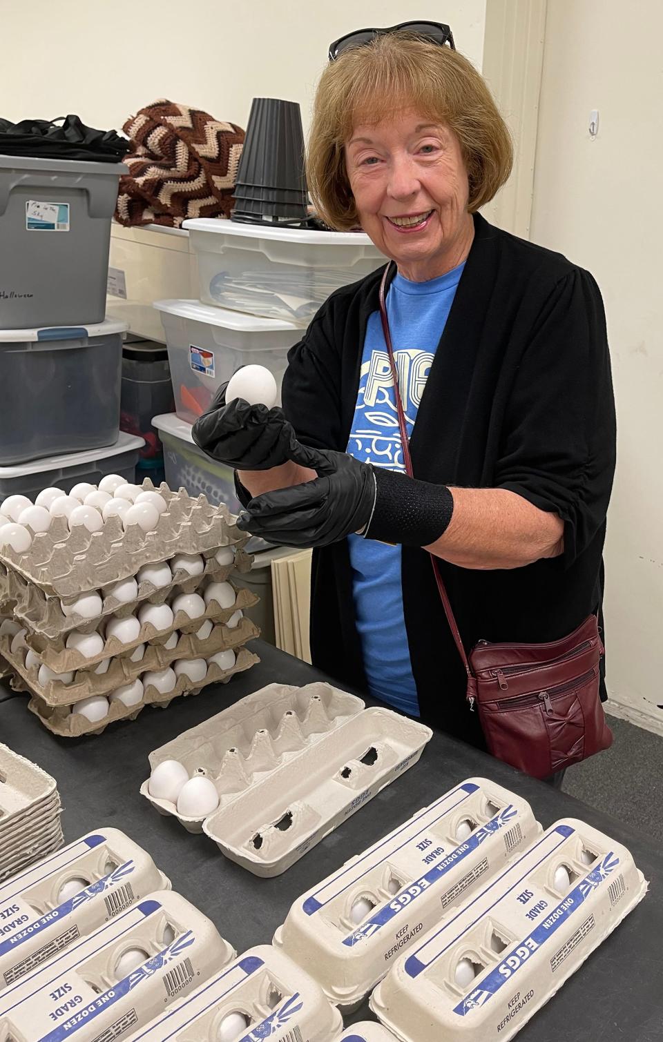 Volunteer Betty Clark inspects and sorts eggs at the Pie in the Sky Community Alliance warehouse in St. Augustine. After egg prices rose dramatically, the nonprofit began a fundraising campaign to provide eggs for low-income seniors.